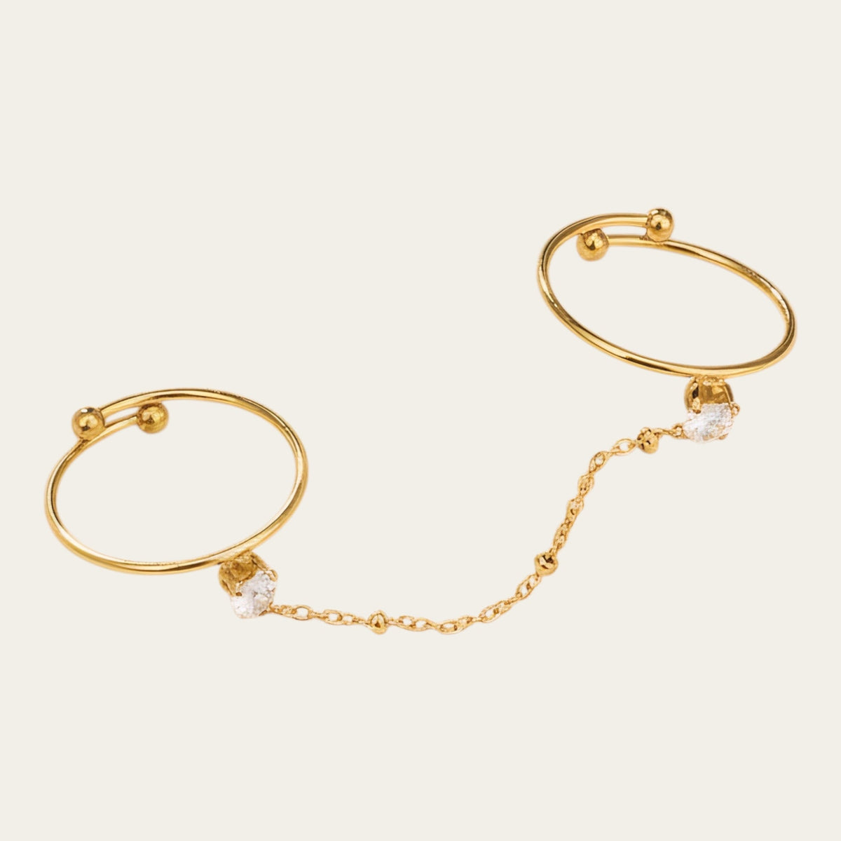 Time4Me adjustable gold-tone double finger ring featuring a delicate chain and sparkling rhinestone heart accents.