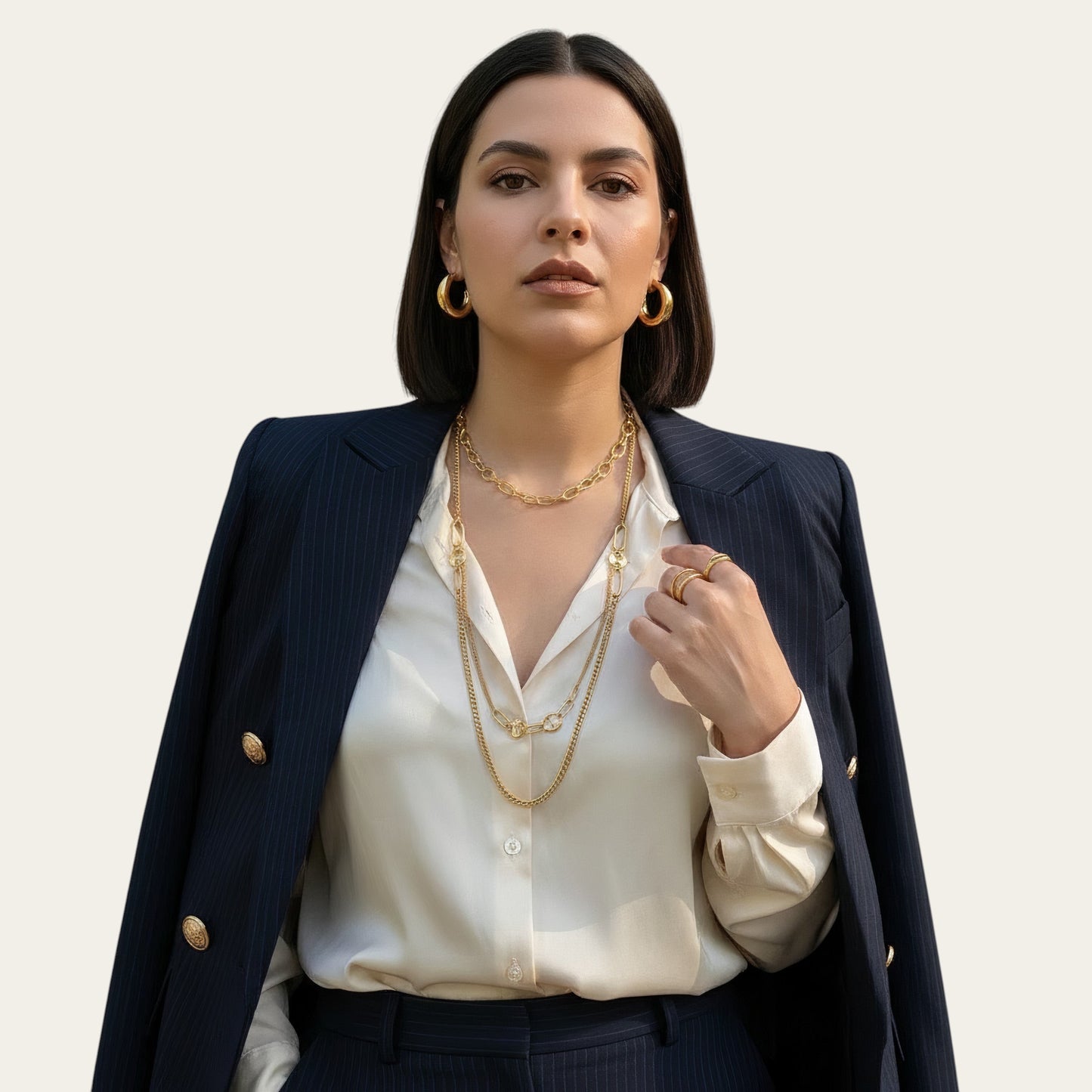 Time4Me gold stainless steel long necklace with mixed fine chains and large oval links worn by a woman in a blazer