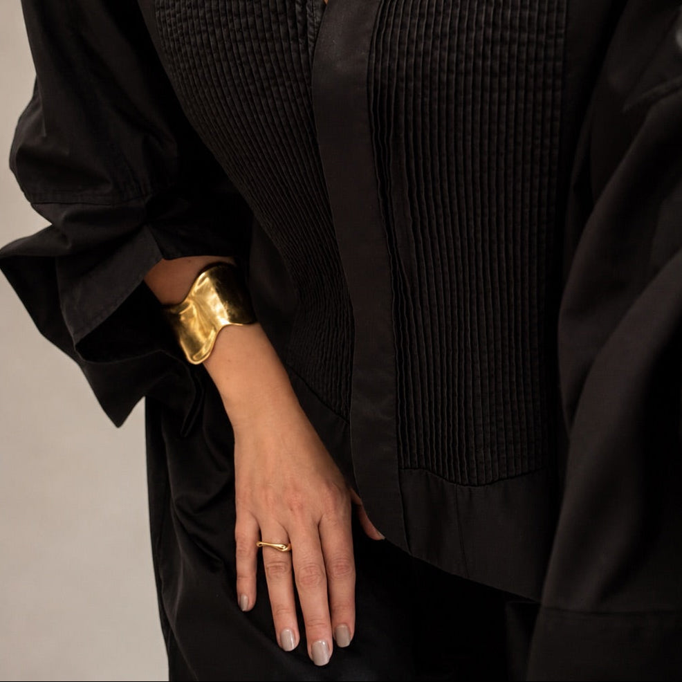 Time4Me adjustable gold-tone stainless steel ring with an organic shape worn on a woman's finger