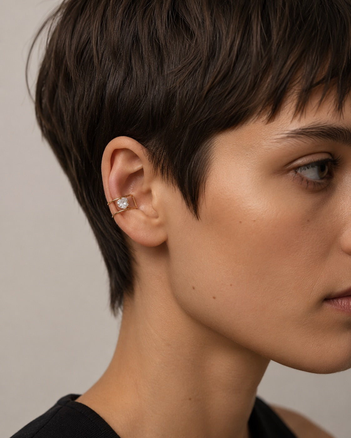 Time4Me gold-tone stainless steel ear cuff featuring a single sparkling rhinestone on a modern open band design