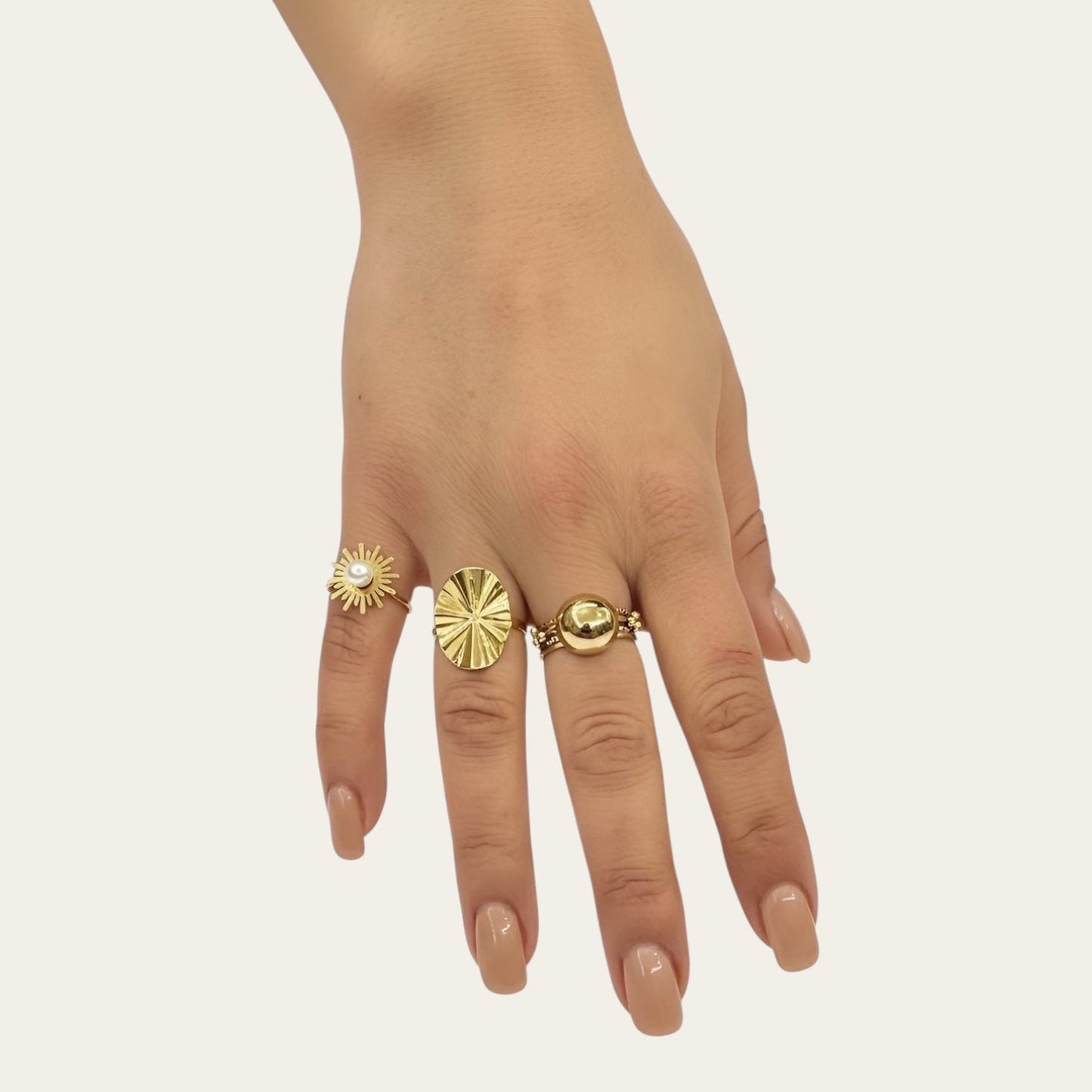 Time4Me gold-tone stainless steel ring set featuring a sunburst pearl ring, textured oval ring, and a ball ring.
