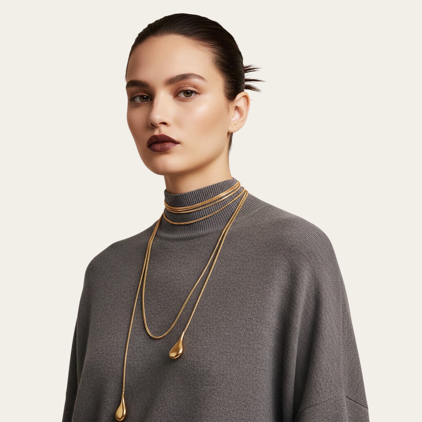 Time4Me long gold stainless steel chain necklace worn by a model in a grey sweater for a layered elegant look