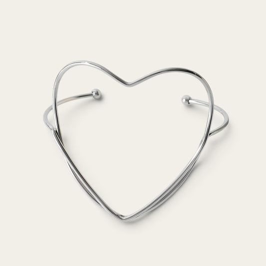 Time4Me silver-tone stainless steel open cuff bracelet featuring a minimalist heart-shaped design