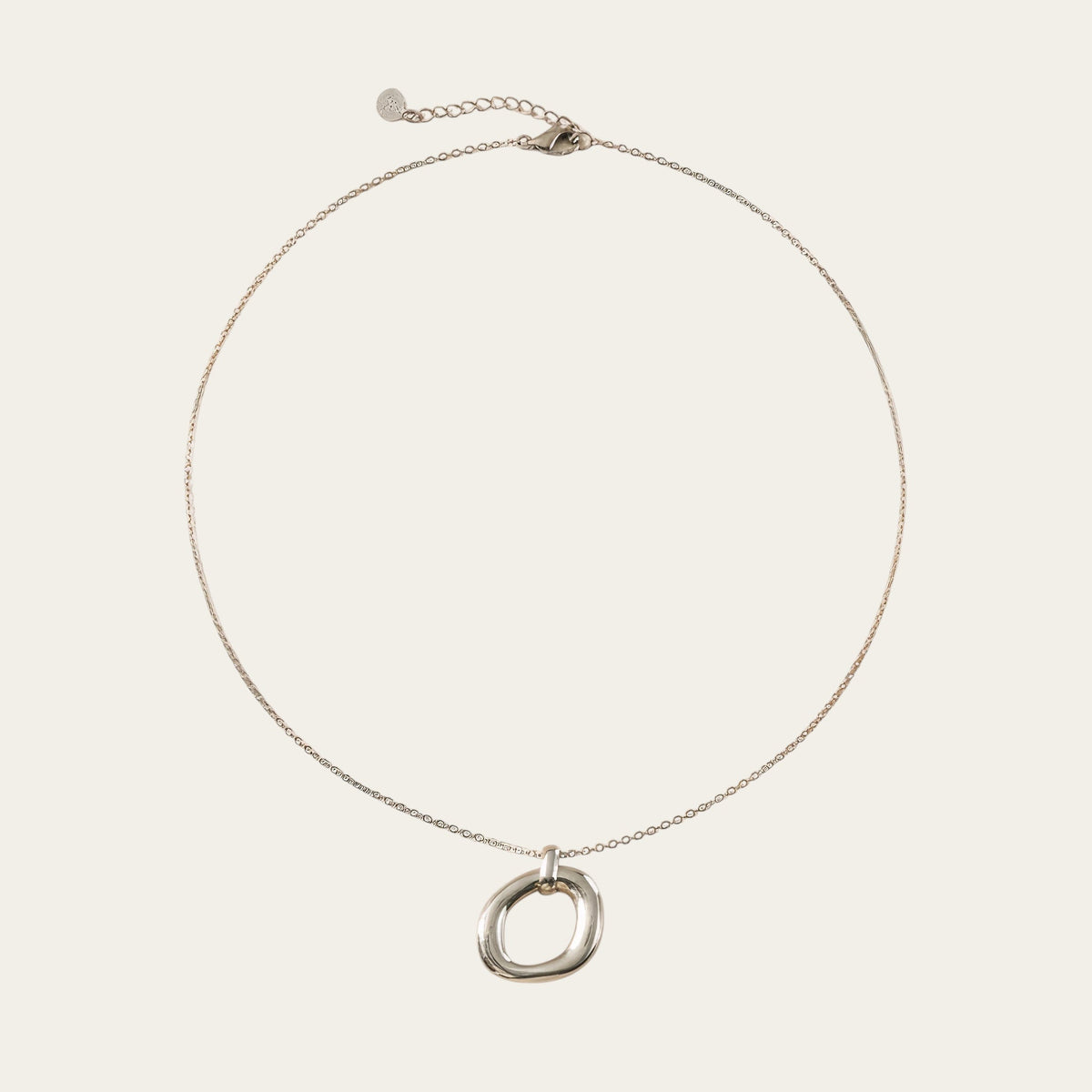 Time4Me silver-tone stainless steel necklace featuring a minimalist oval pendant with a relief design.
