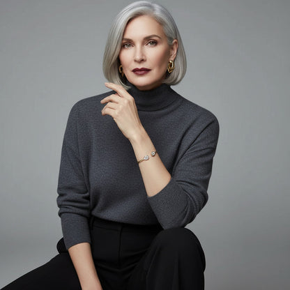 Time4Me adjustable gold stainless steel bracelet with glass crystals worn by a woman in a grey turtleneck