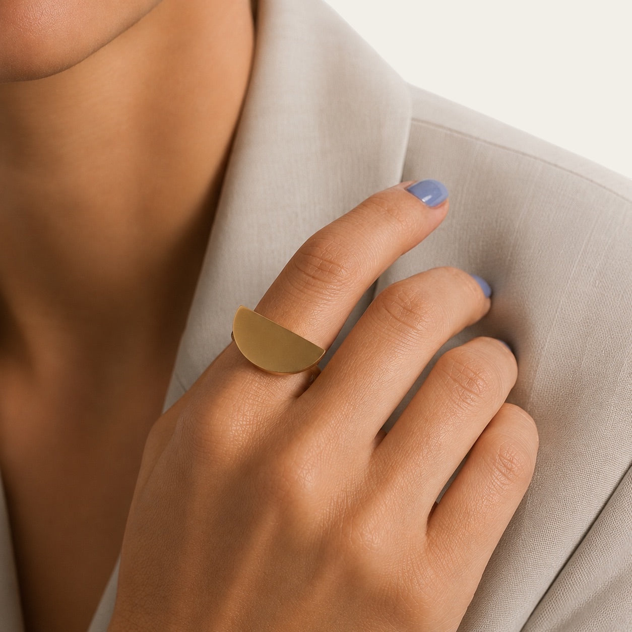 Time4Me adjustable gold ring featuring a thick semi-disc design worn on a finger against a neutral blazer background