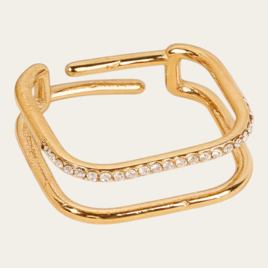 Time4Me gold-tone adjustable square ring with one smooth band and one band encrusted with small clear rhinestones.