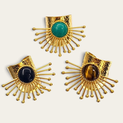 Time4Me adjustable gold-tone stainless steel rings with sunburst design and tiger eye, green, and black stone accents.