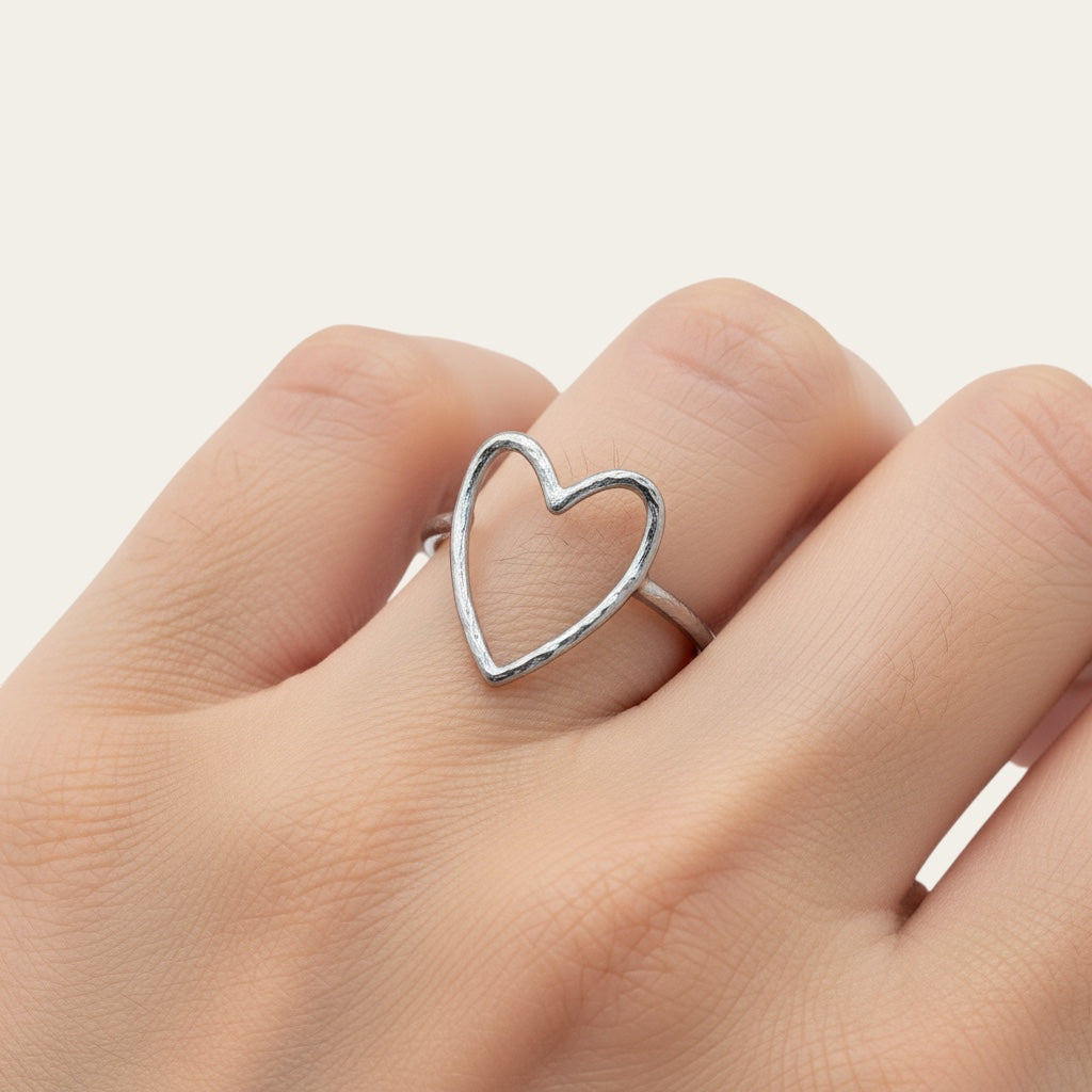 Time4Me adjustable silver-tone stainless steel ring featuring a delicate open heart design worn on a finger