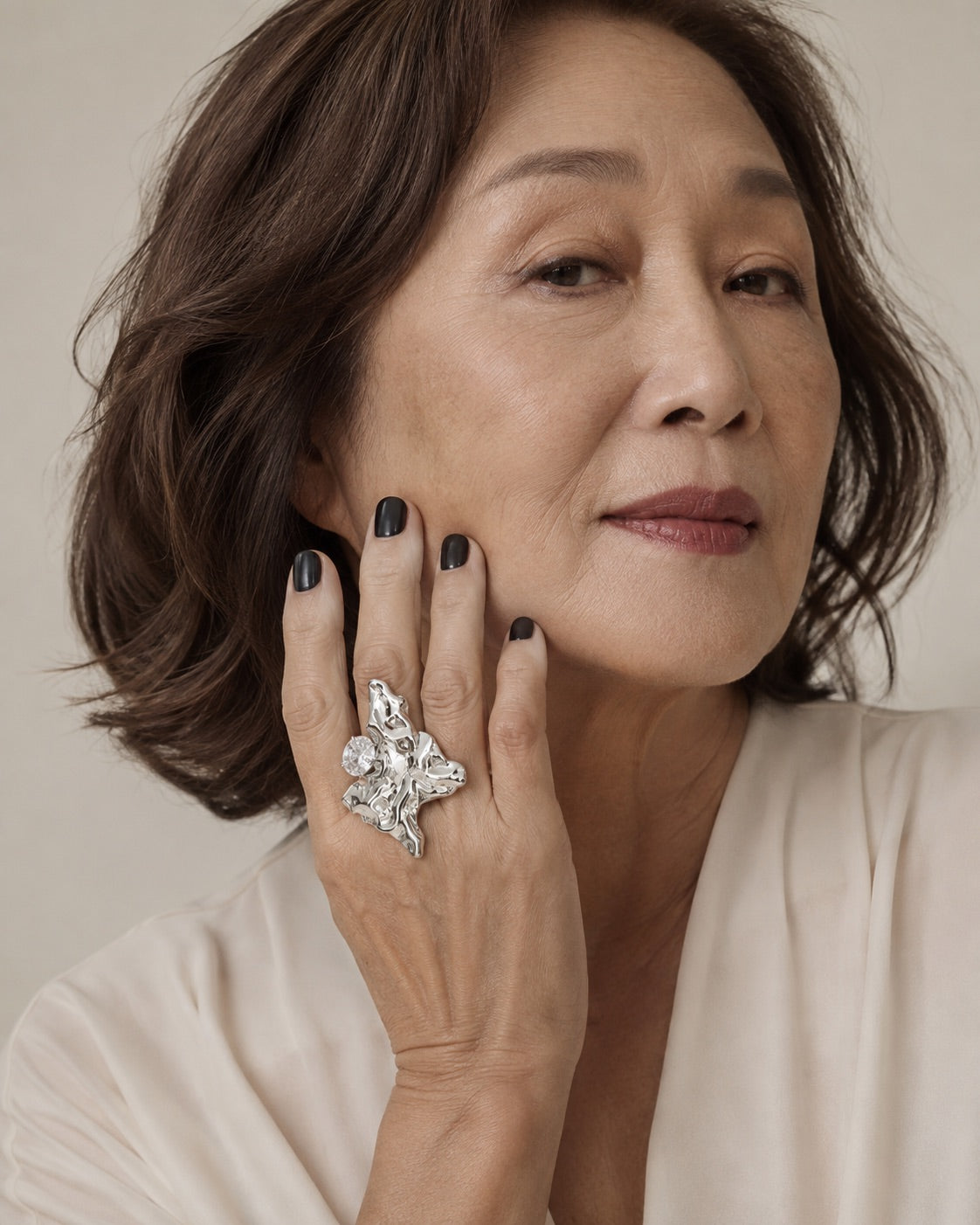 Time4Me adjustable silver ring with irregular textured surface and rhinestone detail worn by a woman