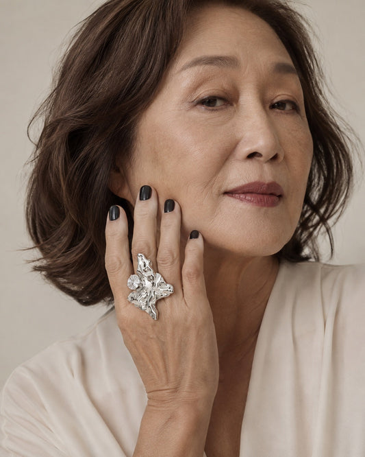 Time4Me adjustable silver ring with irregular textured surface and rhinestone detail worn by a woman