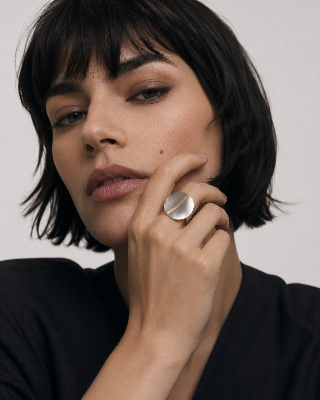 Time4Me adjustable silver stainless steel ring with a brushed circular disc worn by a woman