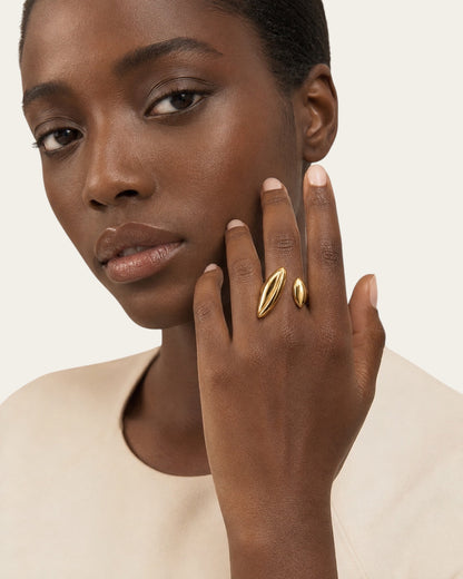 Time4Me duoform adjustable gold ring with a polished finish worn on a model's finger