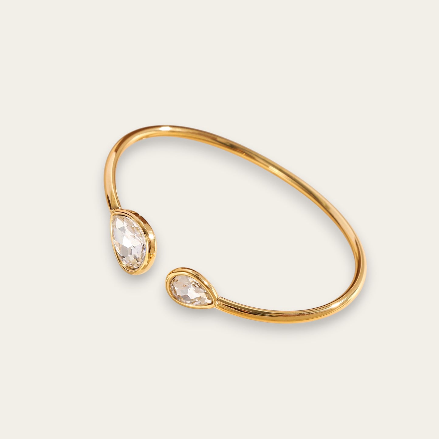 Time4Me adjustable gold stainless steel cuff bracelet featuring two teardrop-shaped glass crystals