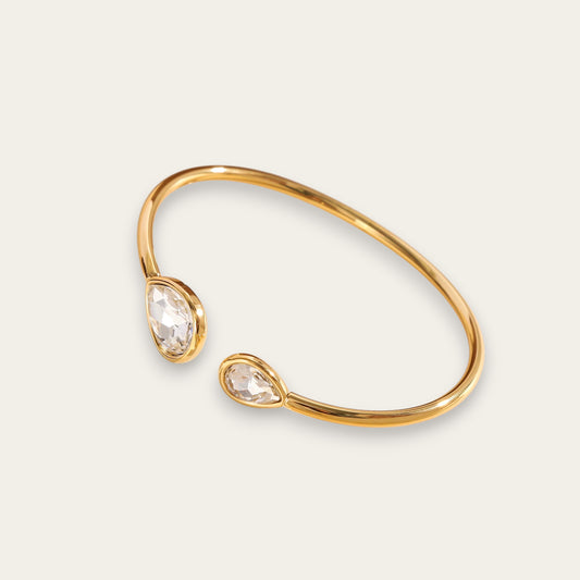 Time4Me adjustable gold stainless steel cuff bracelet featuring two teardrop-shaped glass crystals