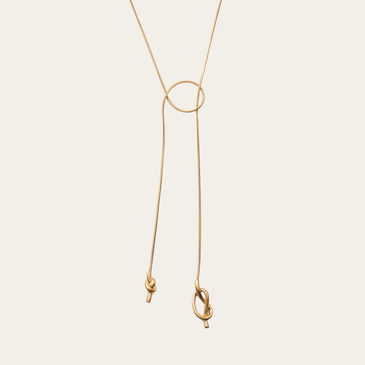 Time4Me 100cm gold-tone stainless steel long necklace featuring an elegant asymmetrical knot design
