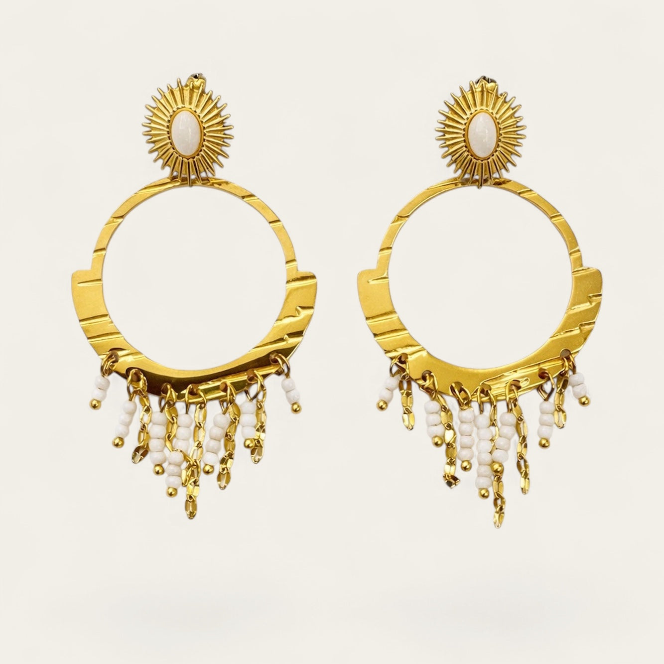 Time4Me gold boho hoop earrings with white beaded fringe and sunburst stud detail made of stainless steel