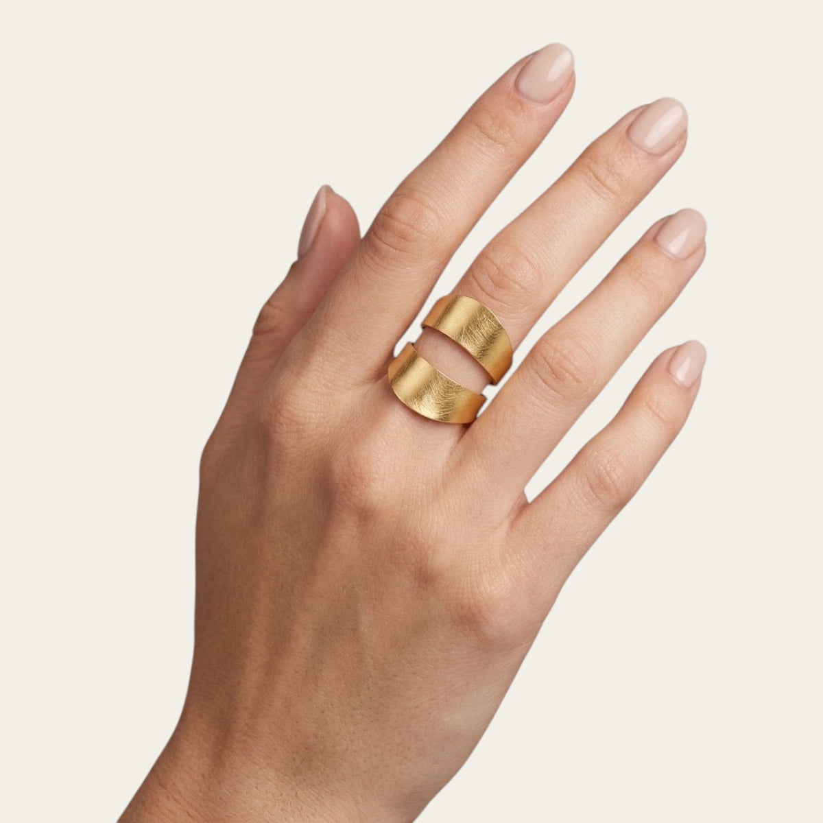 Time4Me gold brushed adjustable stainless steel ring worn on a woman's finger