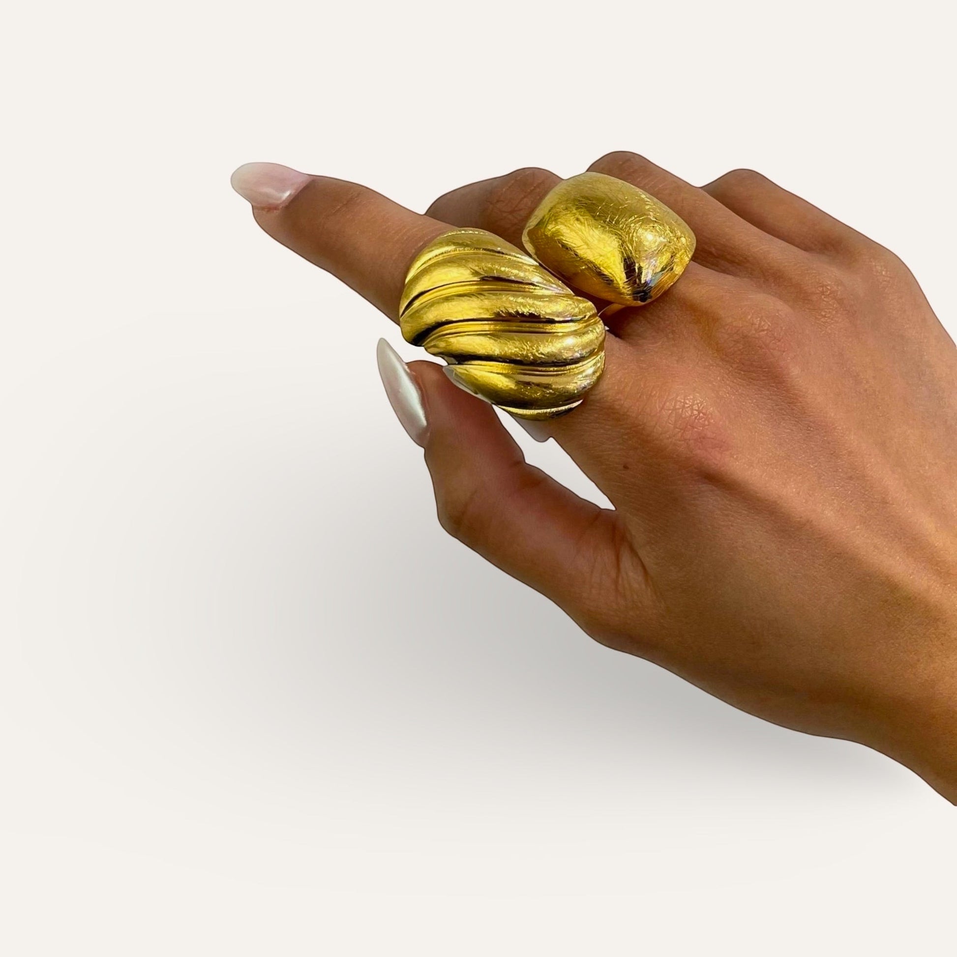 Time4Me gold brushed stainless steel adjustable domed ring worn on a hand with long manicured nails