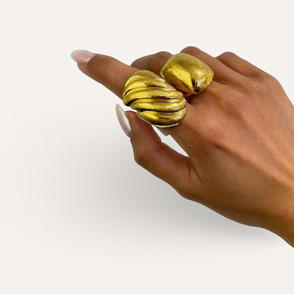 Time4Me gold brushed stainless steel adjustable domed ring worn on a hand with long manicured nails