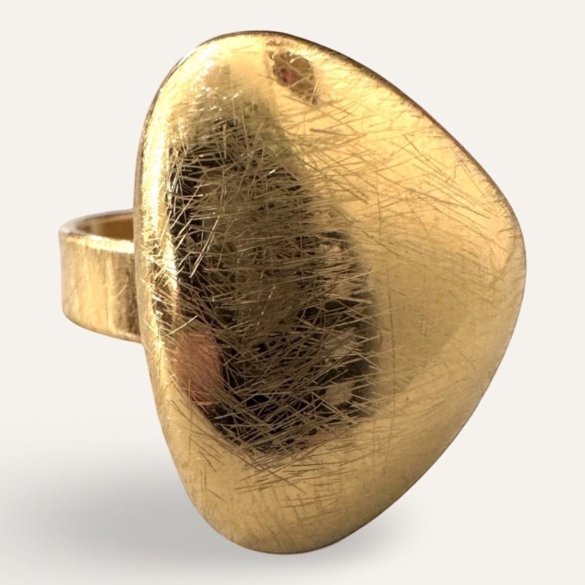 Time4Me gold-toned adjustable ring with a brushed, domed, and organic-shaped surface made of stainless steel.