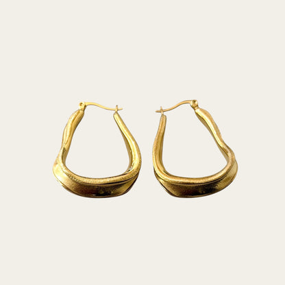 Time4Me brushed gold-tone stainless steel hoop earrings with a unique organic shape for a versatile elegant look.