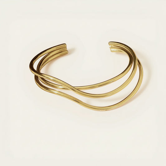 Time4Me gold cuff bracelet with elegant overlapping lines made of durable stainless steel