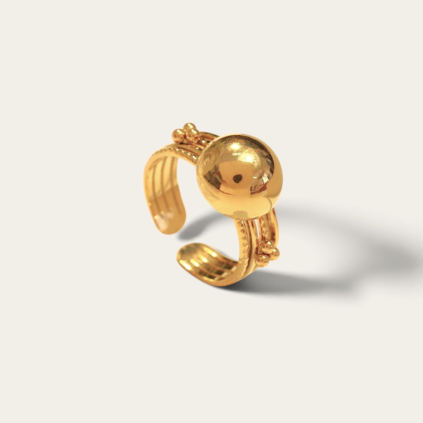 Time4Me gold-toned adjustable ring featuring a smooth domed sphere and delicate beaded detailing in stainless steel.