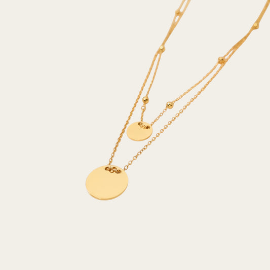 Time4Me gold-tone stainless steel double-chain necklace with two round disc pendants for a layered look.