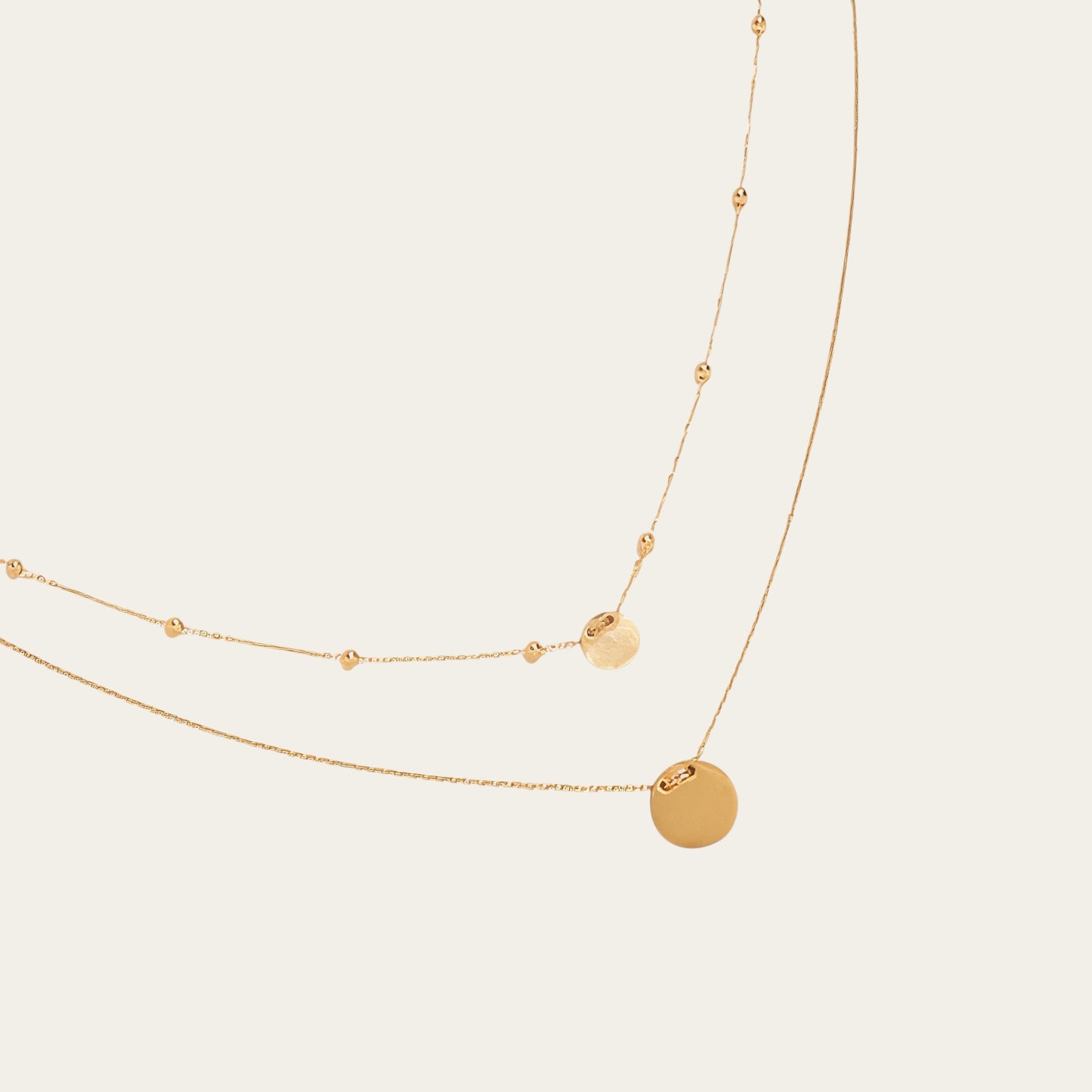Time4Me gold-tone stainless steel double-chain necklace featuring delicate round pendants and small bead accents.