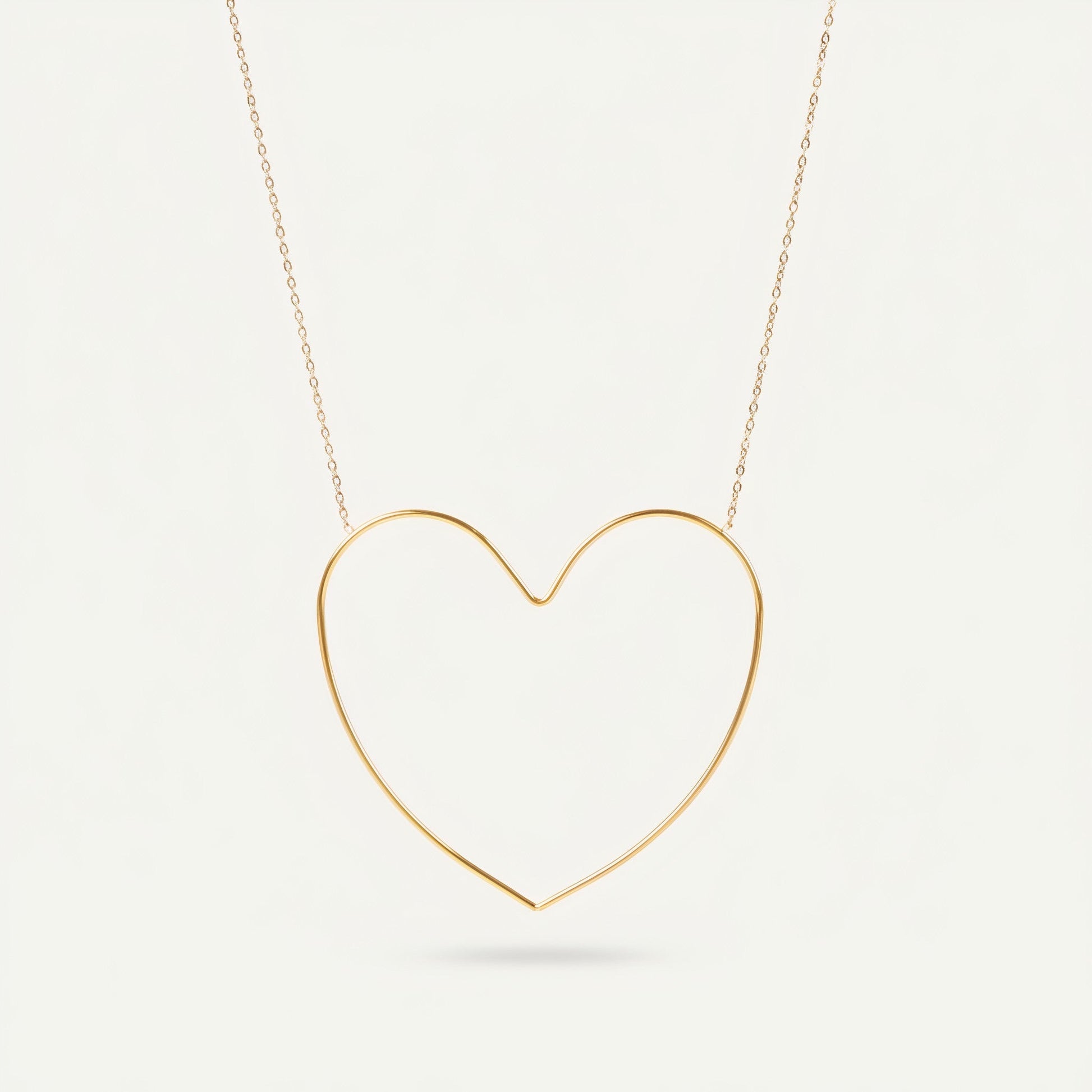 Time4Me gold-tone stainless steel necklace featuring a minimalist stylized open heart pendant on a delicate chain.