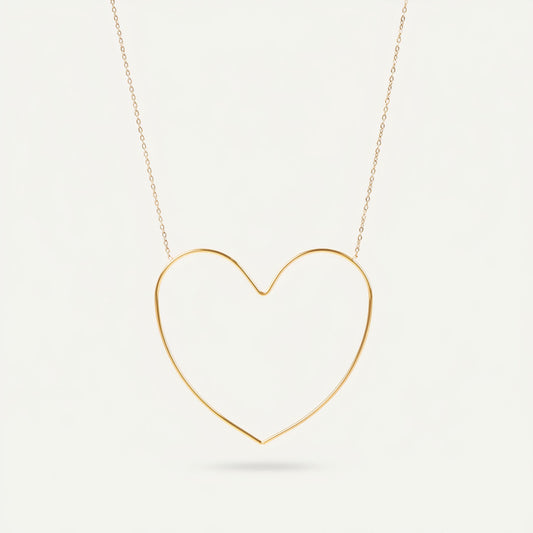 Time4Me gold-tone stainless steel necklace featuring a minimalist stylized open heart pendant on a delicate chain.