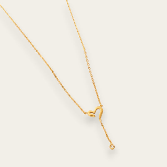 Time4Me gold stainless steel necklace featuring a cutout heart pendant and a delicate dangling crystal charm