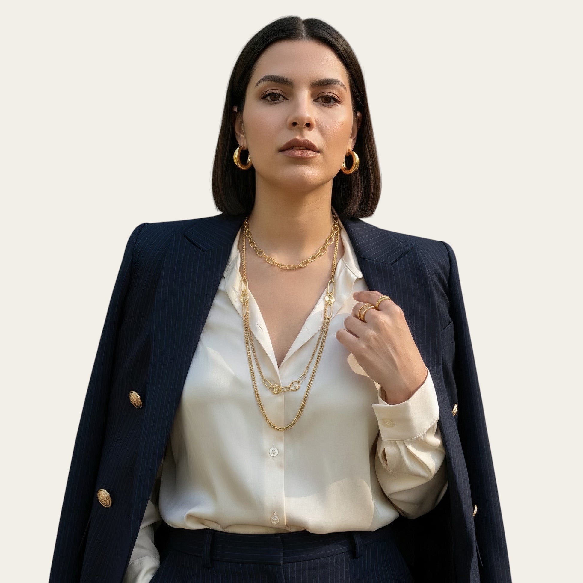 Time4Me gold stainless steel long necklace with mixed fine chains and large oval links worn by a woman in a blazer