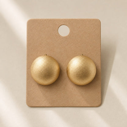 Time4Me gold matte half-sphere stud earrings made of stainless steel on a display card