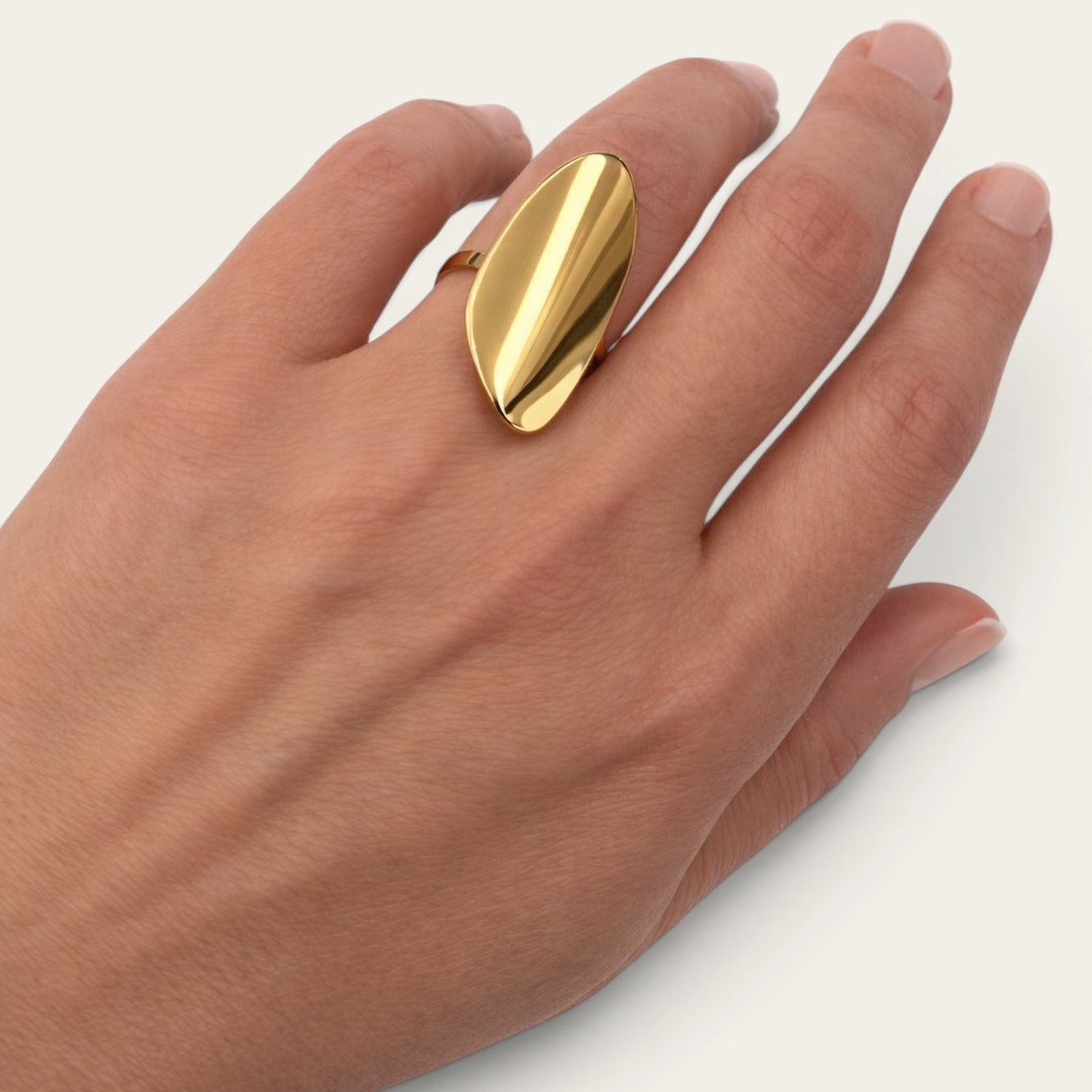 Time4Me adjustable gold-tone stainless steel ring with a modern polished oval design worn on a woman's finger