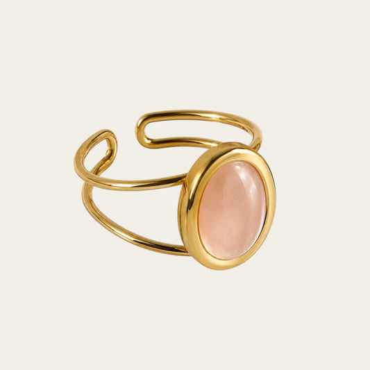 Time4Me adjustable gold stainless steel ring with a smooth oval pink stone centerpiece