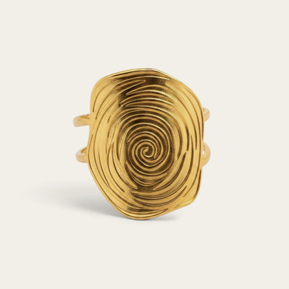Time4Me gold-tone stainless steel adjustable ring featuring a textured oval spiral design on a neutral background.