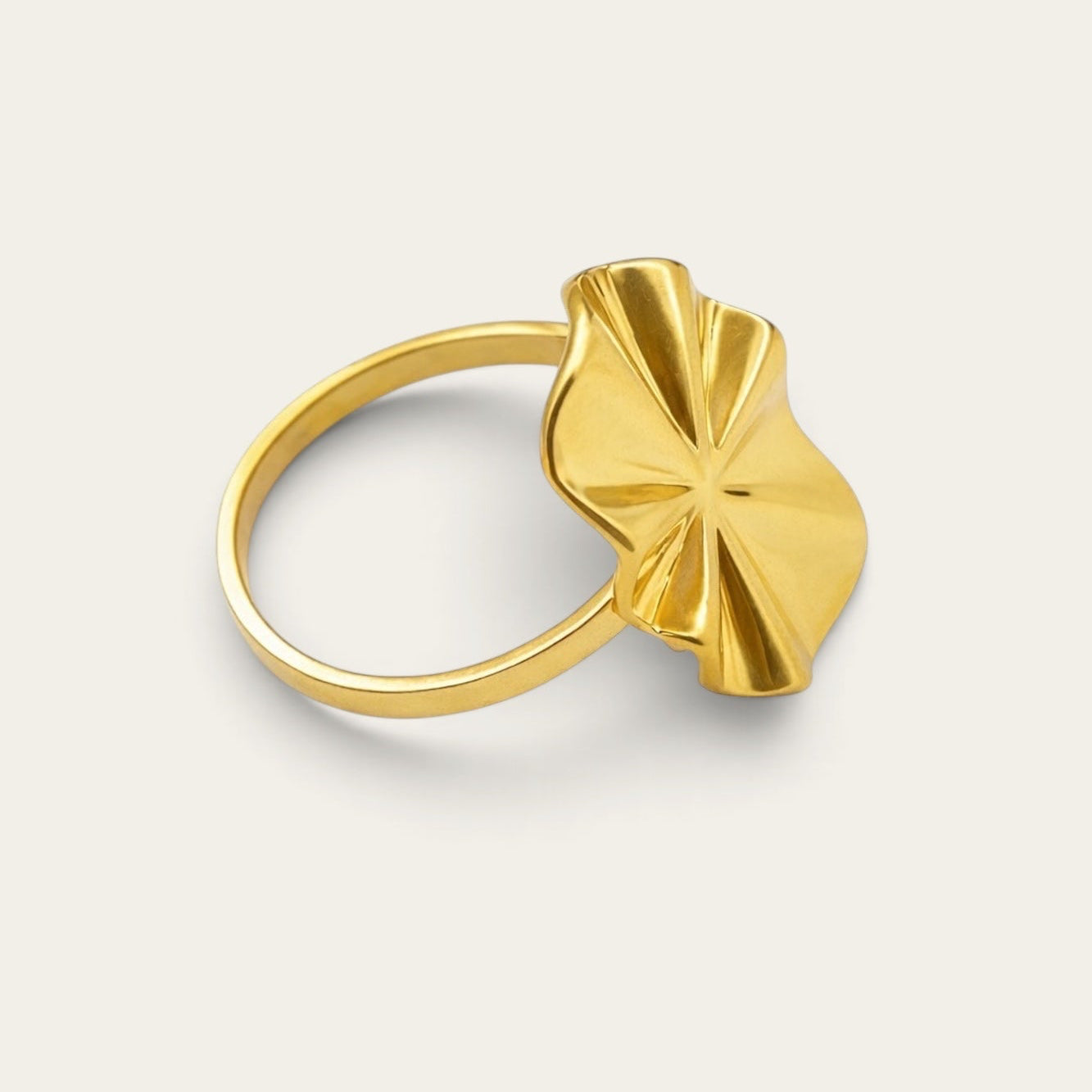 Time4Me gold-tone adjustable stainless steel ring with a wavy oval design on a neutral background