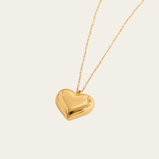 Time4Me gold-tone stainless steel necklace featuring a polished puffy heart pendant with a reflective mirror finish.