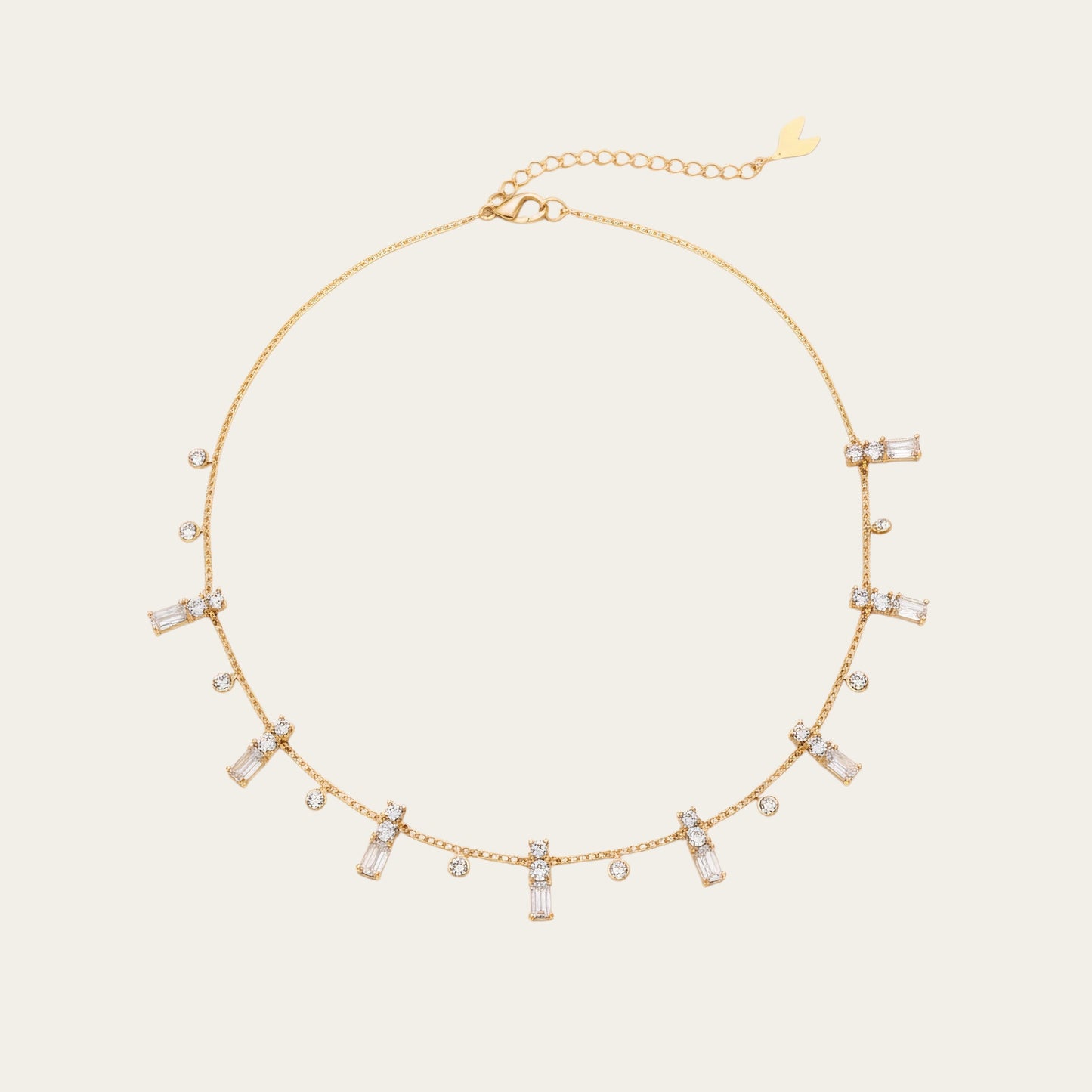 Time4Me gold chain necklace featuring delicate dangling baguette and round rhinestone charms in stainless steel.