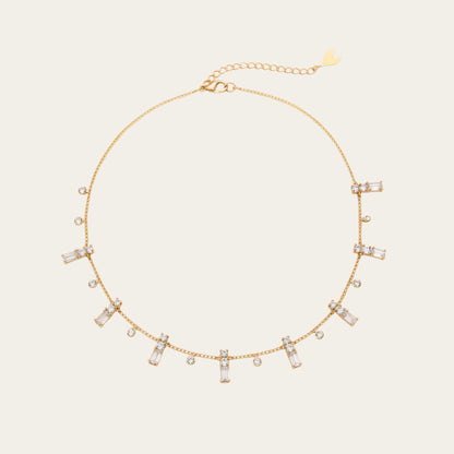 Time4Me gold chain necklace featuring delicate dangling baguette and round rhinestone charms in stainless steel.