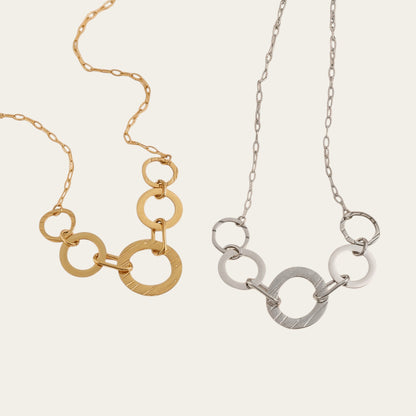 Time4Me silver and gold tone stainless steel necklaces featuring multiple smooth and brushed interlocking rings