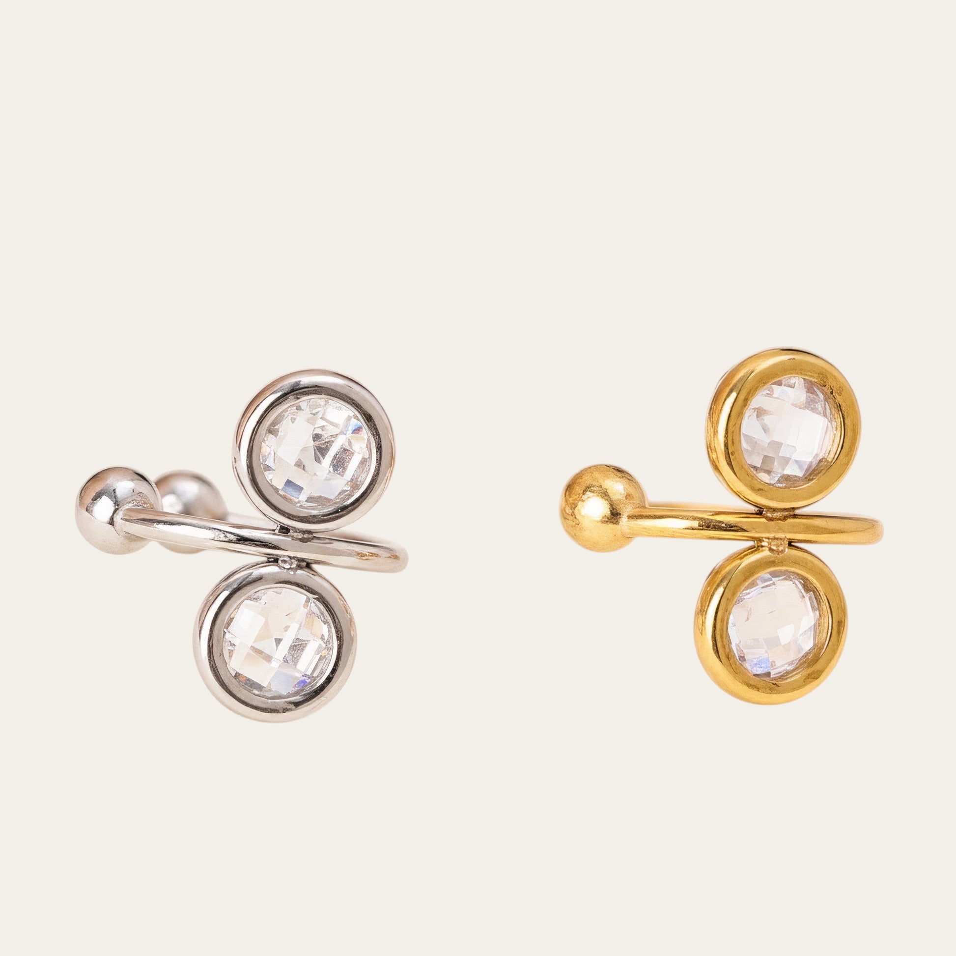 Time4Me gold and silver tone stainless steel ear cuffs featuring two round clear rhinestones in a modern design.