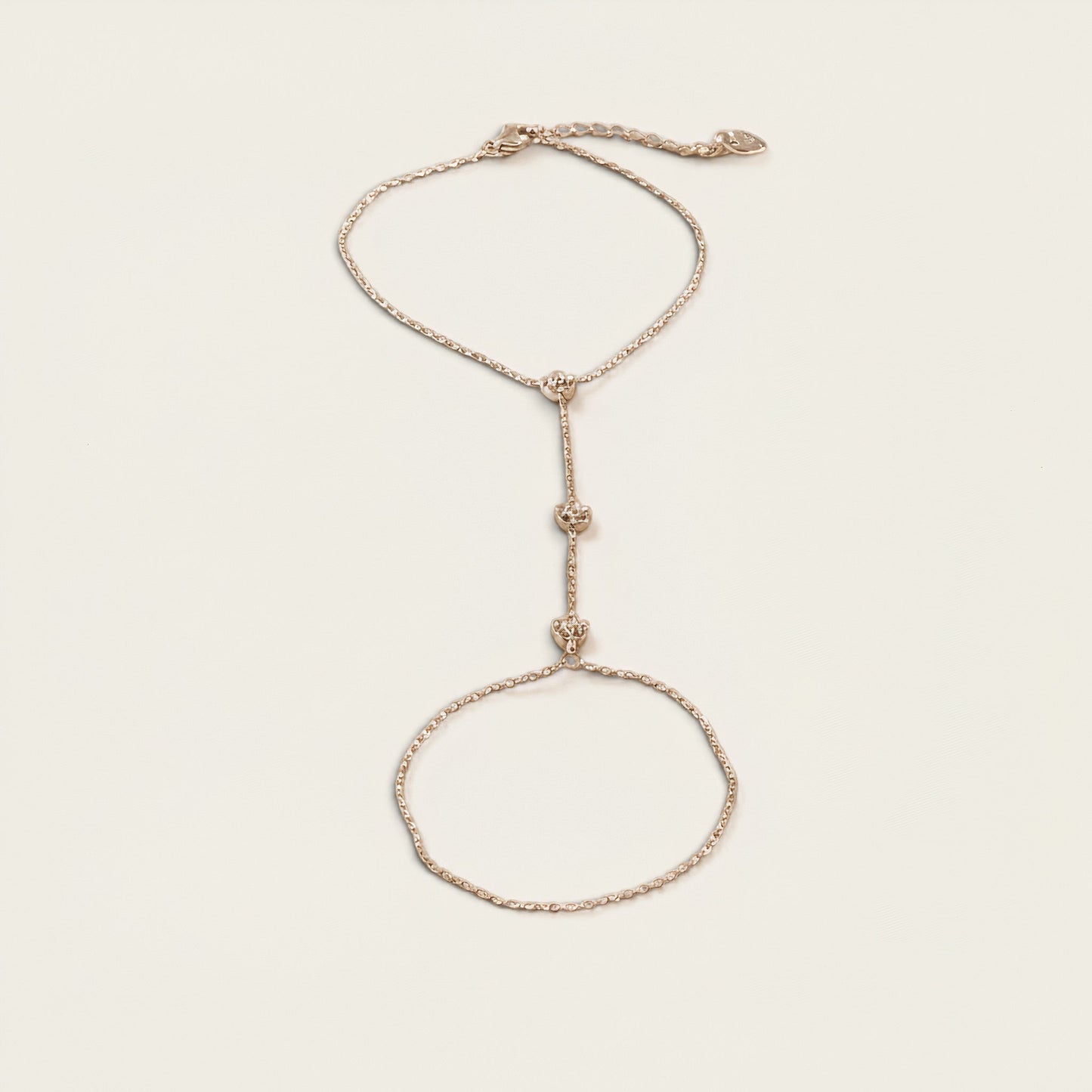 Time4Me gold-tone slave bracelet made of stainless steel with delicate chain links and decorative central accents.