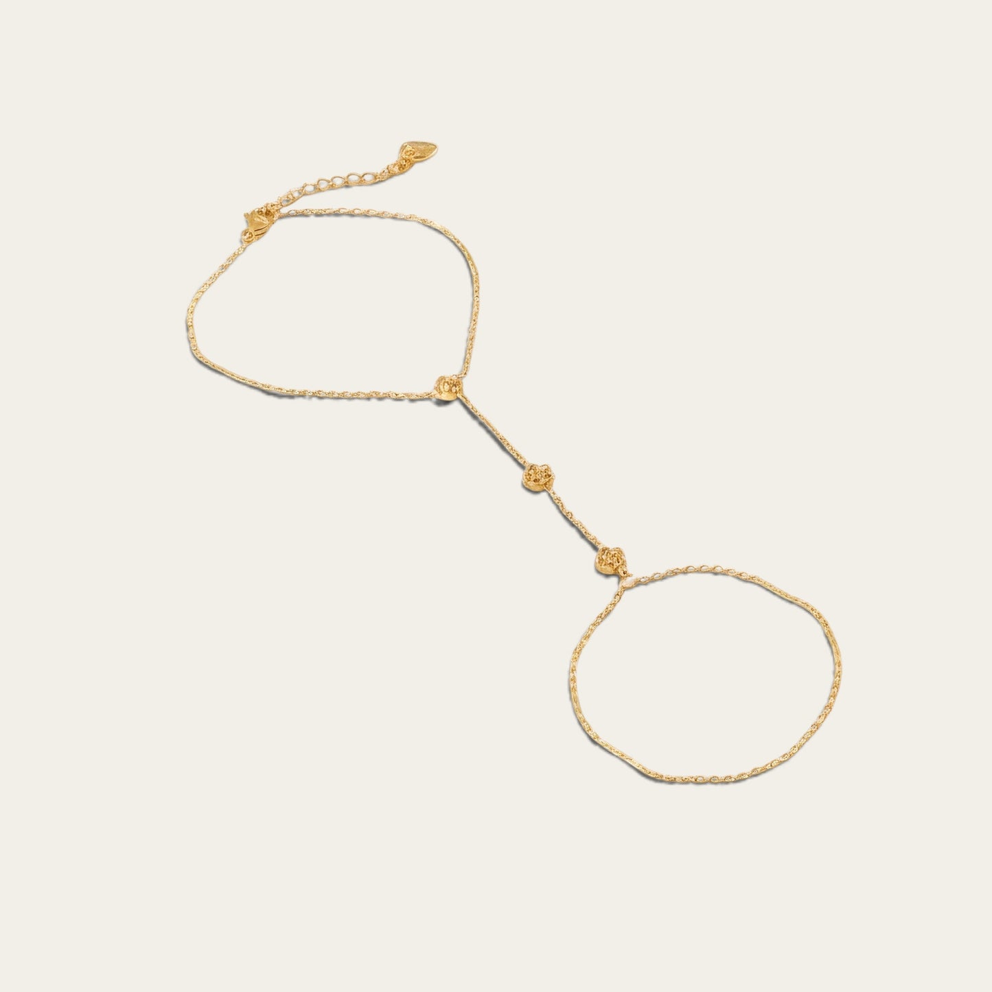 Time4Me gold-tone slave bracelet featuring delicate chain links and small floral accents for a statement look.