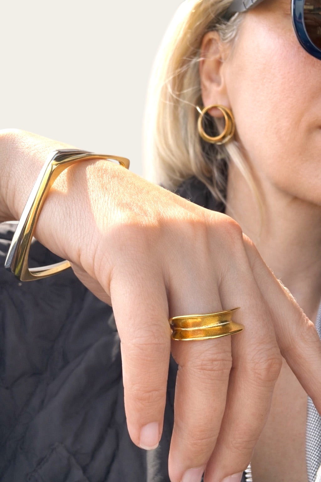 Time4Me gold square stainless steel bracelet worn on a woman's wrist with a matching gold ring