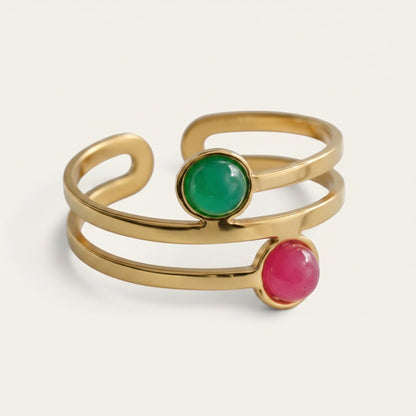 Time4Me gold-tone stainless steel adjustable ring featuring a dual band design with green and pink circular stones.
