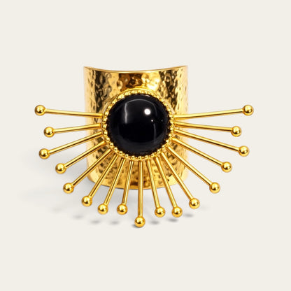 Time4Me gold-tone stainless steel adjustable ring featuring a hammered texture and a central black stone sunburst design