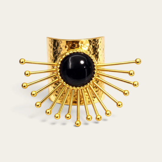 Time4Me gold-tone stainless steel adjustable ring featuring a hammered texture and a central black stone sunburst design